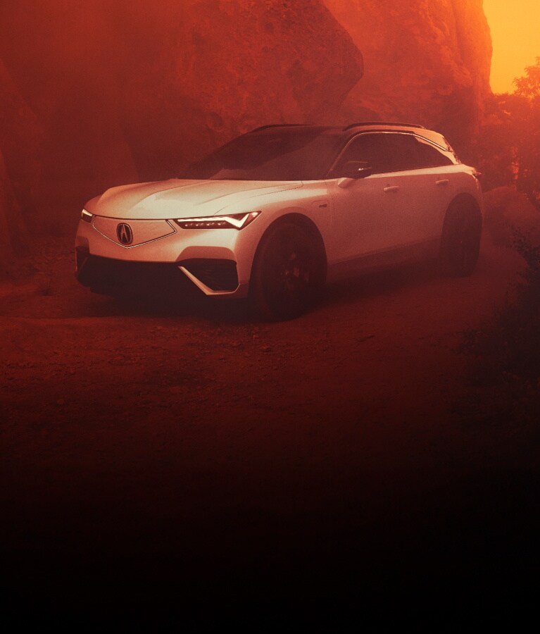 2024 Acura ZDX Type in Snowfall Pearl in a rocky background at sundown