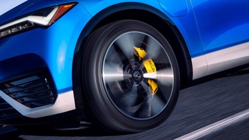 2024 Acura ZDX Type S in Double Apex Blue Pearl, detail of the front wheel in motion 2024 Acura ZDX Type S in Double Apex Blue Pearl, detail of the front wheel in motion