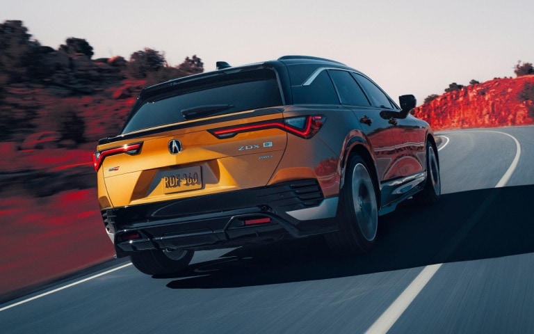 Acura 2024 ZDX Type S in Tiger Eye Pearl on the road