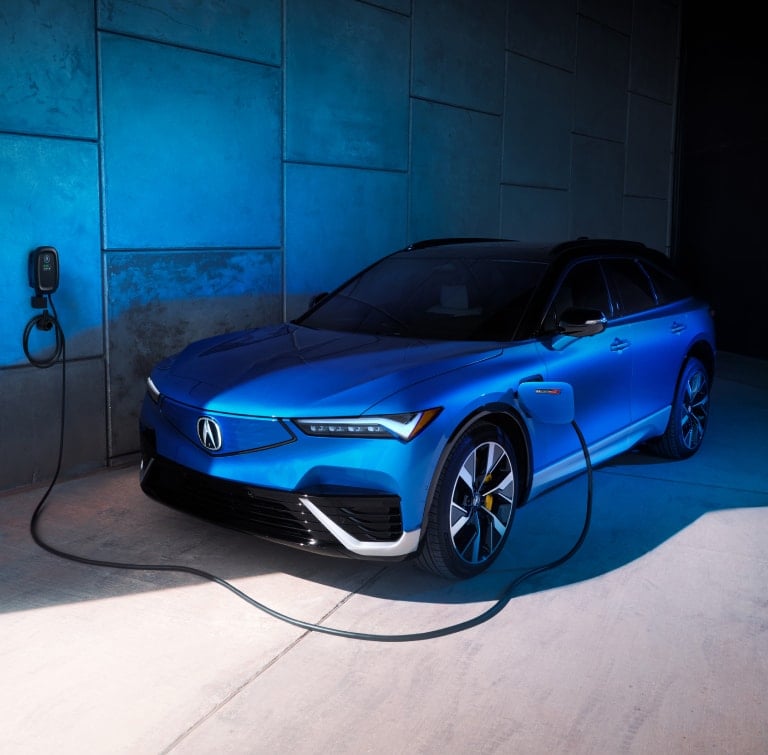 Acura 2024 ZDX in Double Apex Blue Pearl Using a Home Charging station