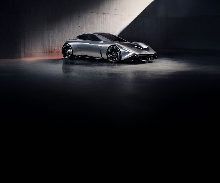 2026 Acura concept car profile showcased in a dark minimalist studio with dramatic lighting.