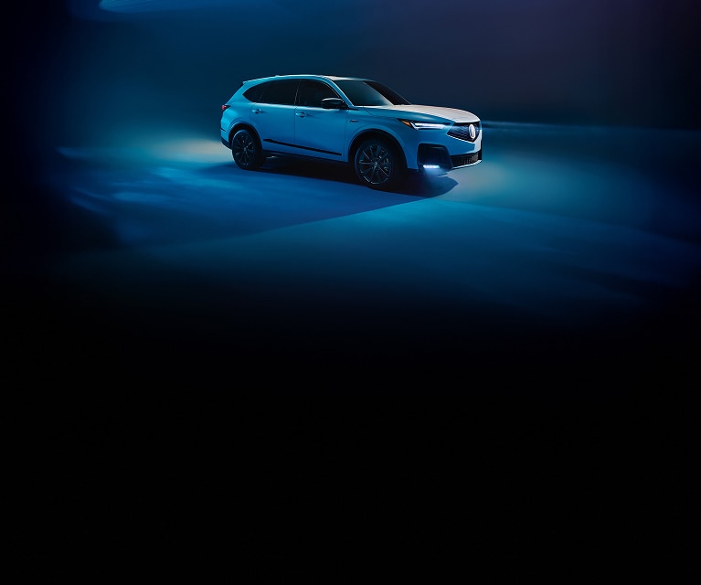 2026 Acura MDX A-Spec Package in Platinum White Pearl profile in a dark studio with blue lighting. (Premium Performance SUV).