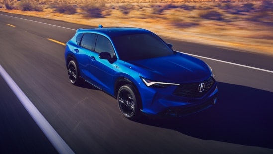 2025 Acura ADX A-Spec with Advance Package in Adriatic Sea blue front driving on a scenic desert road (Premium Compact SUV).