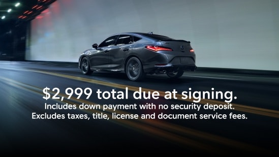 2025 Acura Integra A-Spec rear driver view driving on a tunnel