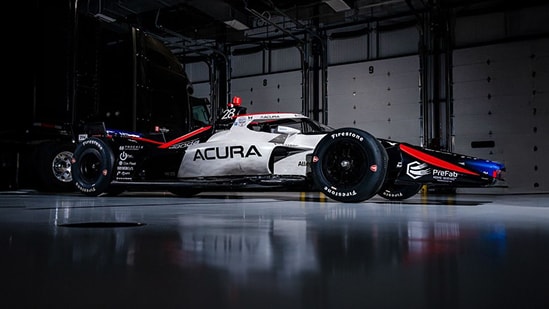 2026 Acura-branded Honda parked inside a professional racing garage.