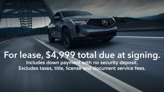 Acura 2026 RDX SH-AWD in Liquid Carbon Metallic with on screen offer text for lease, $4,999 total due at signing. Includes down payment with no security deposit. Excludes taxes, title, license and document service fees.