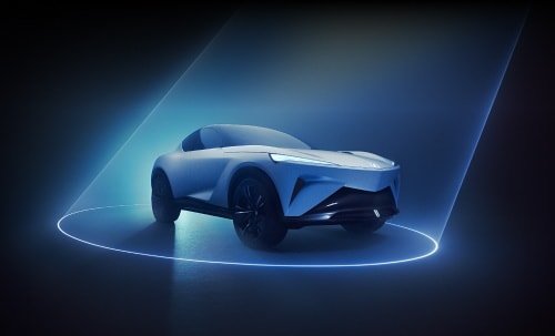 View of the Acura CBEV concept car from the passenger side surrounded by a ring of light.