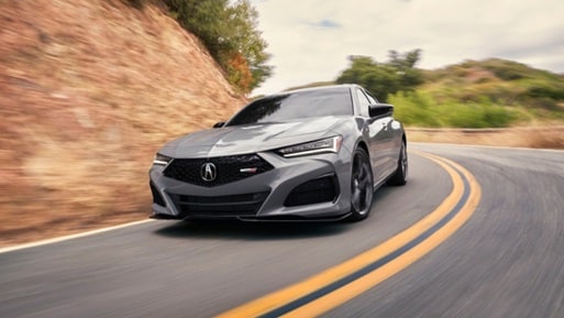Front view of TLX in Urban Gray Pearl action shot Front view of TLX in Urban Gray Pearl action shot