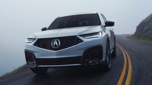 MDX front 3/4 action shot in Platinum White Pearl MDX front 3/4 action shot in Platinum White Pearl